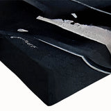 Close-up of a modern abstract canvas wall art piece showcasing vibrant strokes and lines in shades of blue, orange, and gold, perfect for contemporary decor.