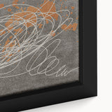 Close-up of a framed canvas wall art piece showcasing abstract strokes and lines in vibrant hues of blue, orange, and gold, perfect for modern decor.