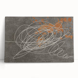 Abstract canvas wall art showcasing colorful strokes and lines, featuring a modern design. The stretched canvas leans against a neutral wall, enhancing contemporary decor. Perfect for adding a vibrant touch to living spaces or offices.