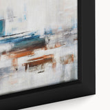 Close-up of a framed canvas showcasing an abstract strokes and lines design in vibrant hues of blue, orange, and gold, enhancing modern home decor aesthetics.