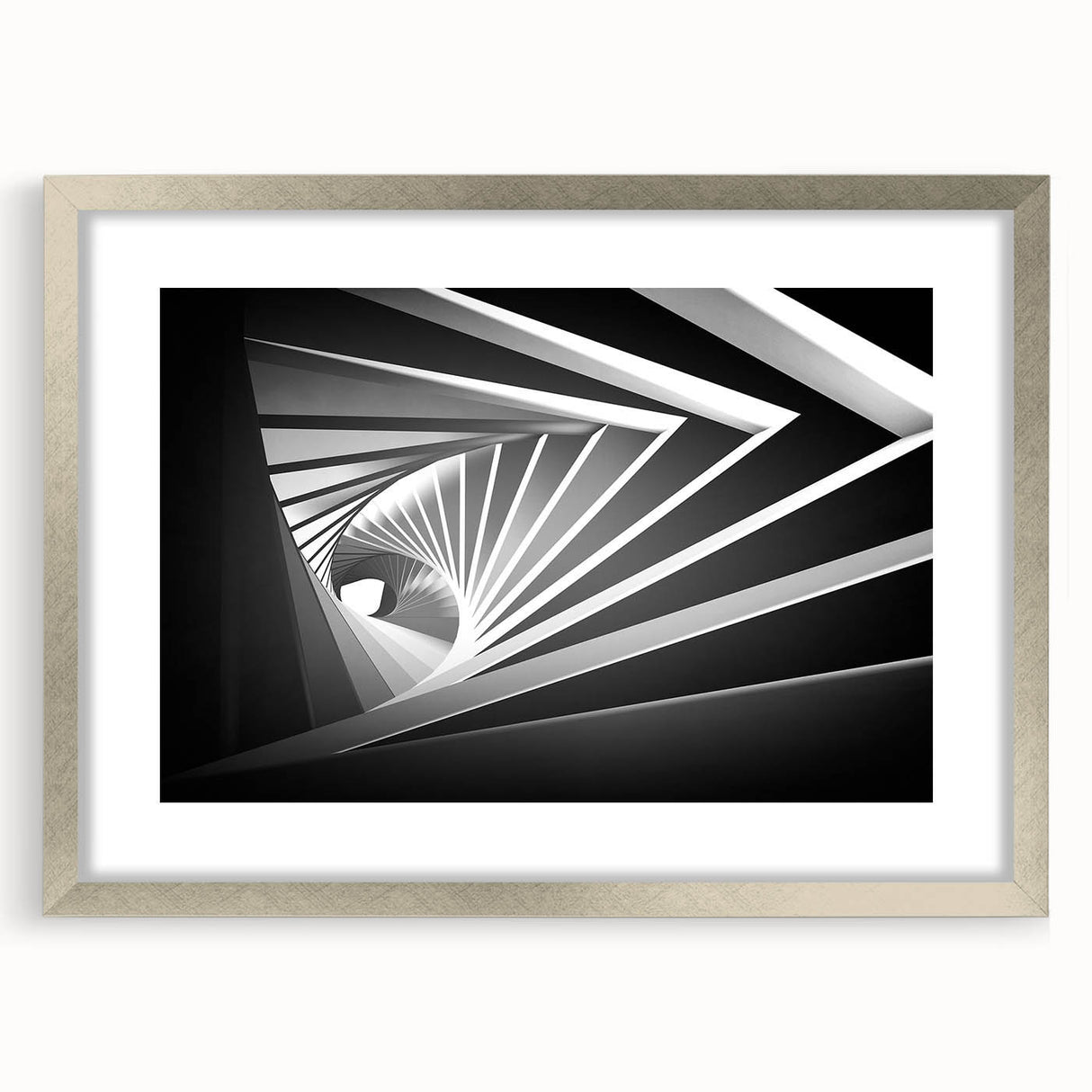 Abstract art print featuring geometric shapes in muted gray and silver, framed in a sleek silver frame.