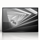 Framed acrylic print of large abstract wall art featuring geometric shapes in black and gray.