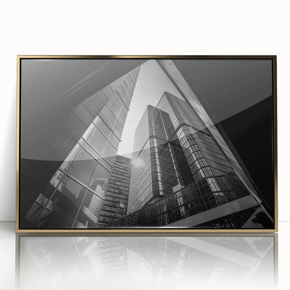 Mid-century modernist art featuring abstract geometric shapes in gold and black on a framed acrylic.