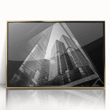 Mid-century modernist art featuring abstract geometric shapes in gold and black on a framed acrylic.