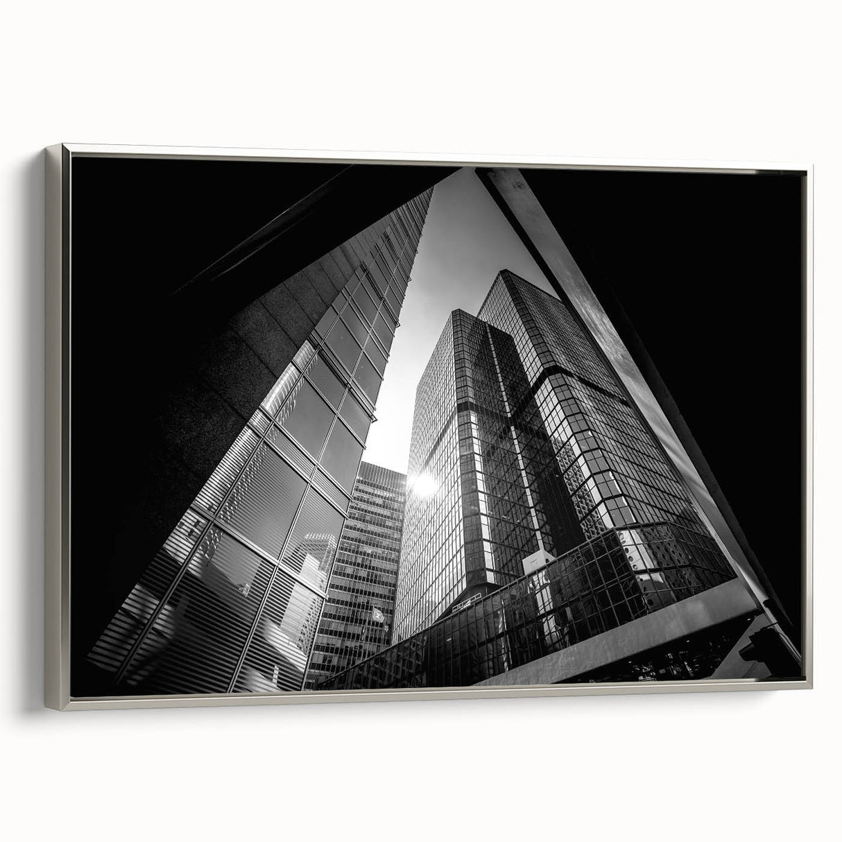 Framed canvas of a vintage poster art depicting abstract architecture in black and colorful tones.
