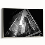 Framed canvas of a vintage poster art depicting abstract architecture in black and colorful tones.
