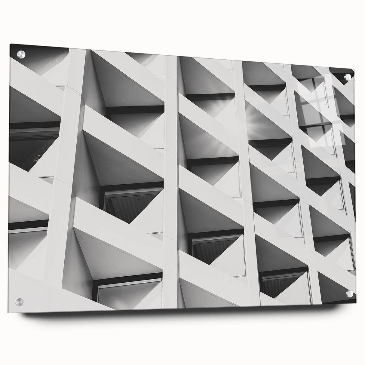 Large abstract wall art on acrylic glass featuring swirling gray and white patterns.