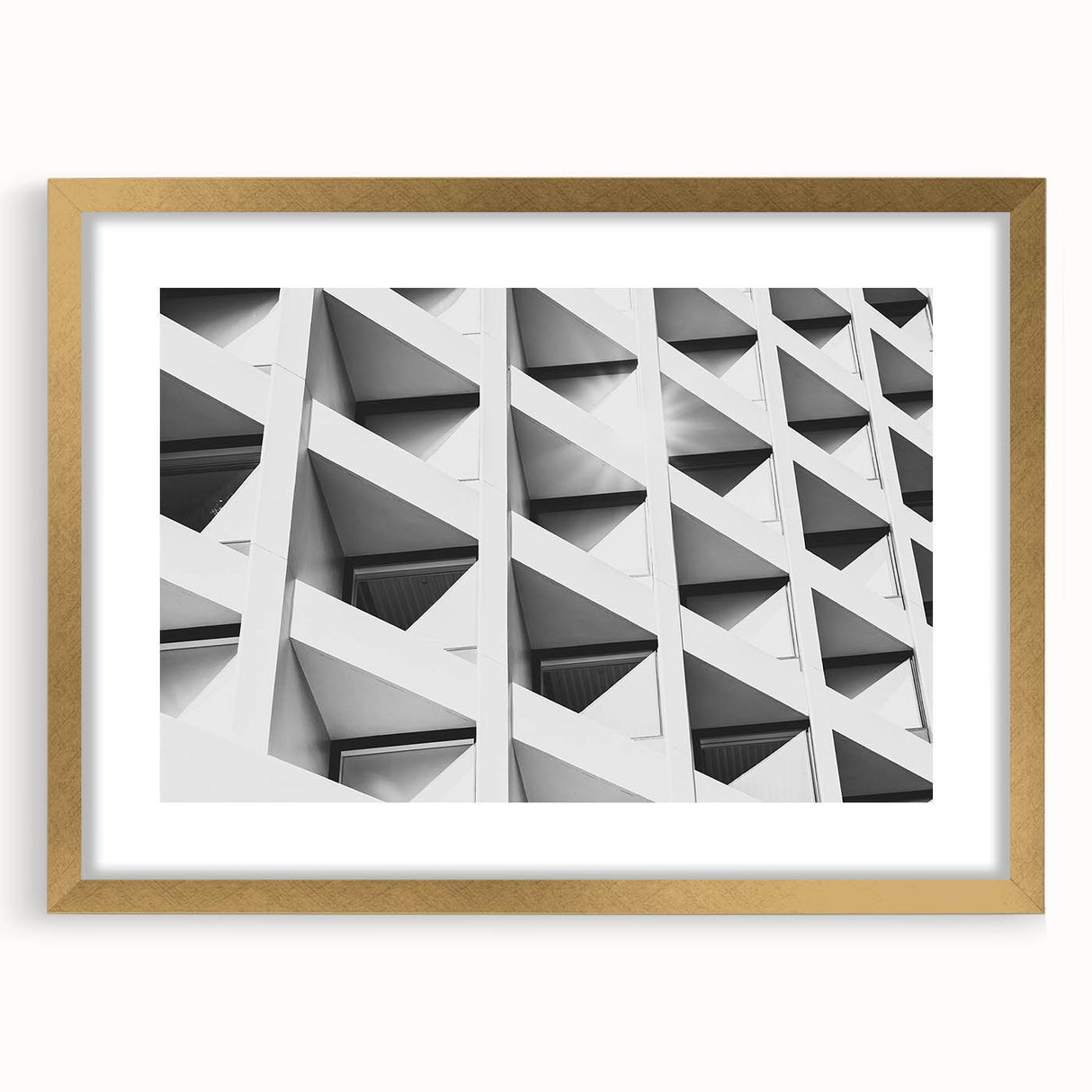 Textured abstract art print in muted gold and gray tones on a framed canvas, suited for modern bedroom decor.