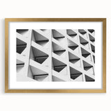 Textured abstract art print in muted gold and gray tones on a framed canvas, suited for modern bedroom decor.