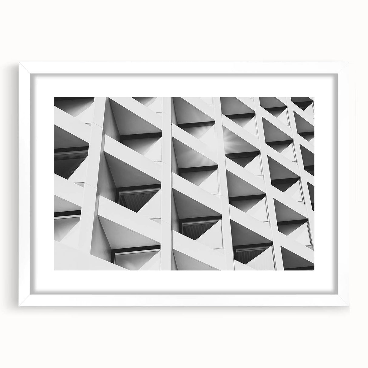 Extra large abstract art print with textured design in muted gray tones on a white framed canvas.