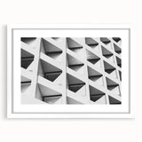 Extra large abstract art print with textured design in muted gray tones on a white framed canvas.