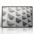 Framed acrylic print of large abstract wall art featuring geometric shapes in muted earth tones.