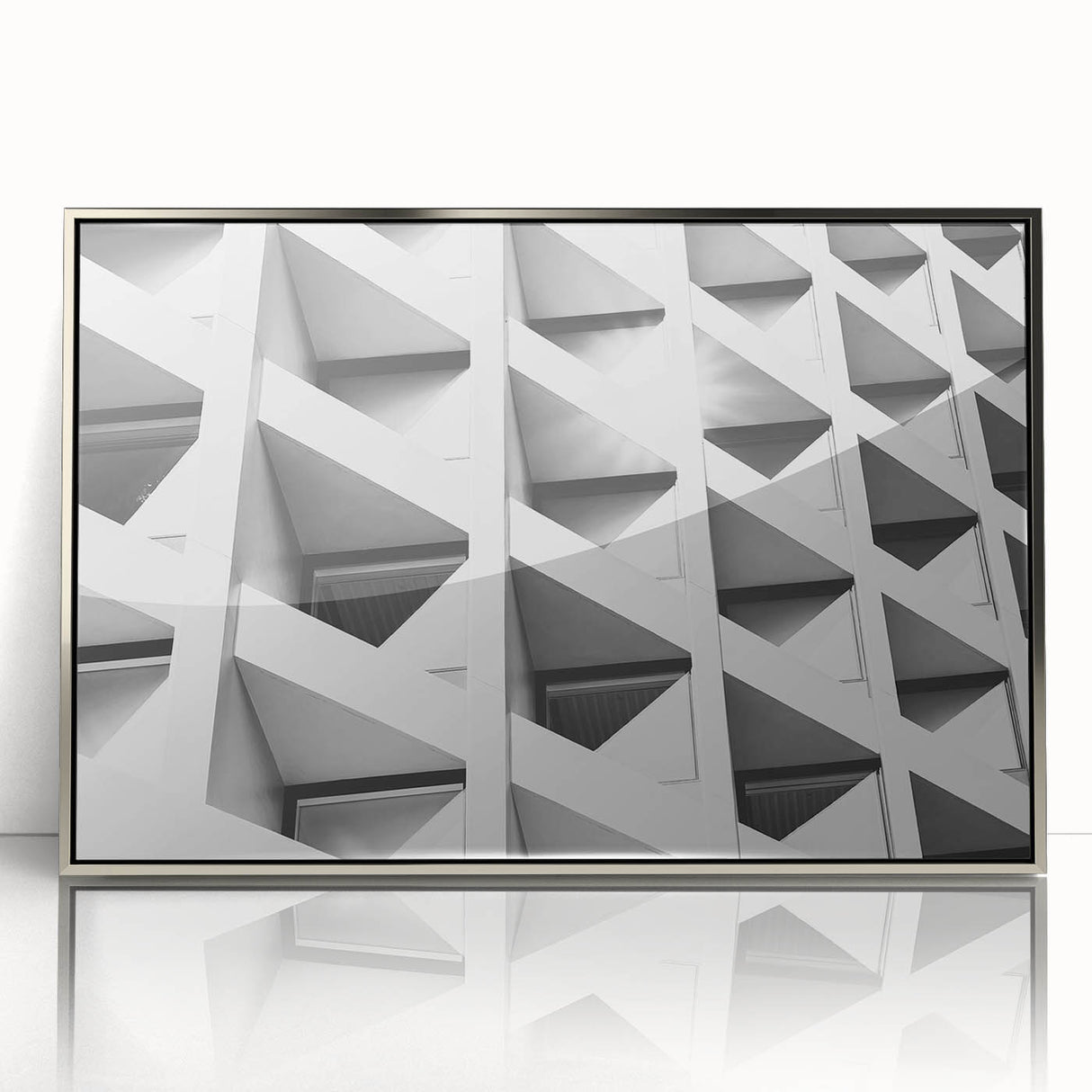 Art deco poster featuring geometric shapes in silver and black on a framed acrylic, ideal for modern nursery wall art.