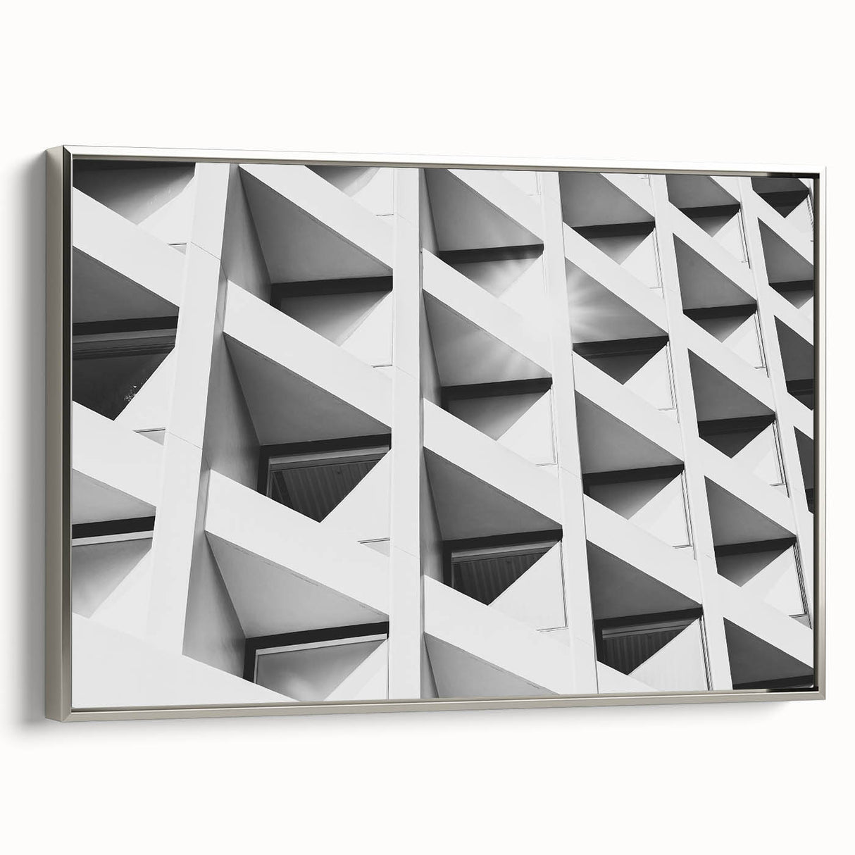 Framed canvas depicting a vintage poster art of abstract architecture in black with colorful accents.