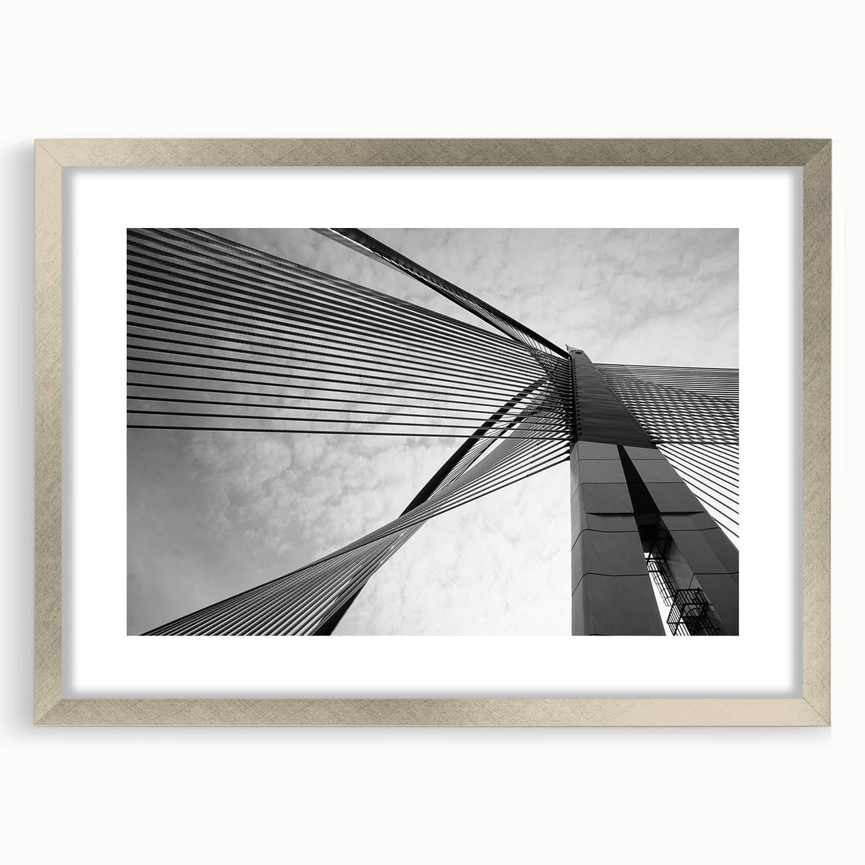 Abstract art print featuring geometric shapes in muted gray and blue tones on a framed silver mat.