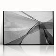 Large abstract wall art featuring geometric shapes in muted beige and gray, framed in black acrylic.