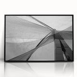 Large abstract wall art featuring geometric shapes in muted beige and gray, framed in black acrylic.