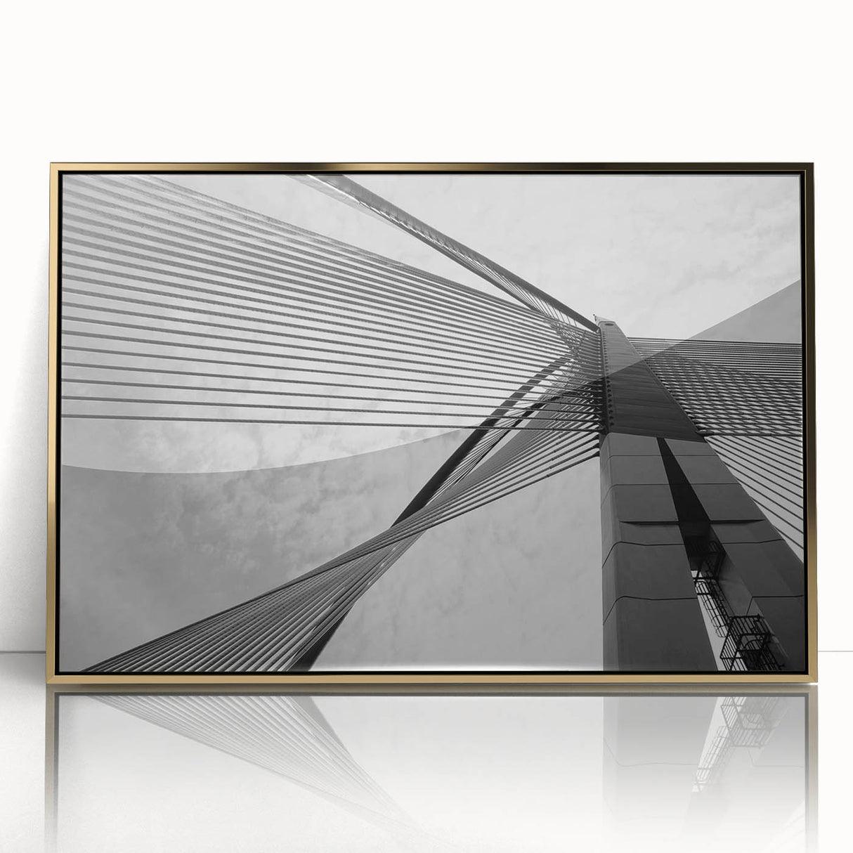 Mid-century modernist art featuring abstract architectural designs in gold and black on a framed acrylic print.