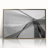 Mid-century modernist art featuring abstract architectural designs in gold and black on a framed acrylic print.