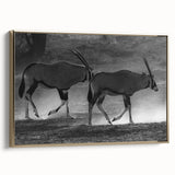 Framed wall art showcasing a striking gold antelope design on canvas, set against a textured background, perfect for adding a touch of elegance to any decor.