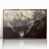 Framed wall art featuring a striking bat design, highlighted with gold accents and set against a sleek acrylic background, perfect for wildlife enthusiasts' decor.