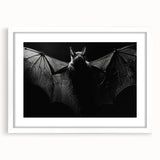 Framed wildlife wall art featuring a bat design in a white mat, set against a minimalist background, perfect for nature-themed decor in homes or offices.