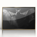 Framed wall art featuring a striking bat design, showcasing intricate details in black and gold colors, perfect for wildlife enthusiasts and modern decor.