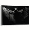 Framed wall art featuring a striking bat design, showcasing intricate details and a bold black frame, perfect for enhancing wildlife-themed decor.
