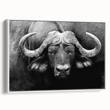 Framed canvas wall art depicting a majestic buffalo in a natural setting, showcasing detailed textures and earthy tones, perfect for wildlife enthusiasts and home decor lovers.