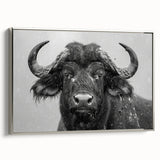 Framed canvas wall art featuring a side view of a majestic buffalo, showcasing intricate details and a silver frame, perfect for wildlife lovers and modern decor.