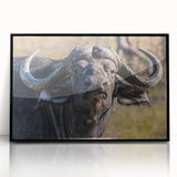 Framed wall art featuring a striking black buffalo design, showcasing intricate details and textures, perfect for adding a touch of wildlife elegance to any space.