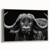 Framed wall art featuring a striking silver side view of a buffalo, showcasing intricate details of its fur and majestic horns against a minimalist backdrop, perfect for wildlife enthusiasts.