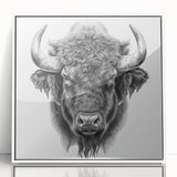 Framed wall art featuring a striking buffalo design in a bold black and white aesthetic, perfect for adding a touch of wildlife decor to any modern space.