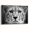 Framed wall art featuring a striking cheetah design in black and white, showcasing the animal's sleek profile against a minimalist background, perfect for wildlife enthusiasts.