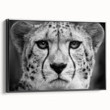 Framed wall art featuring a striking cheetah design in black and white, showcasing the animal's sleek profile against a minimalist background, perfect for wildlife enthusiasts.