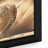 Close-up view of a striking framed canvas wall art featuring a cheetah in a vibrant African savanna landscape, showcasing detailed textures and colors.