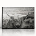 Framed wall art featuring a striking black and white cow design, showcasing intricate details against a minimalistic background, perfect for animal lovers and modern decor.