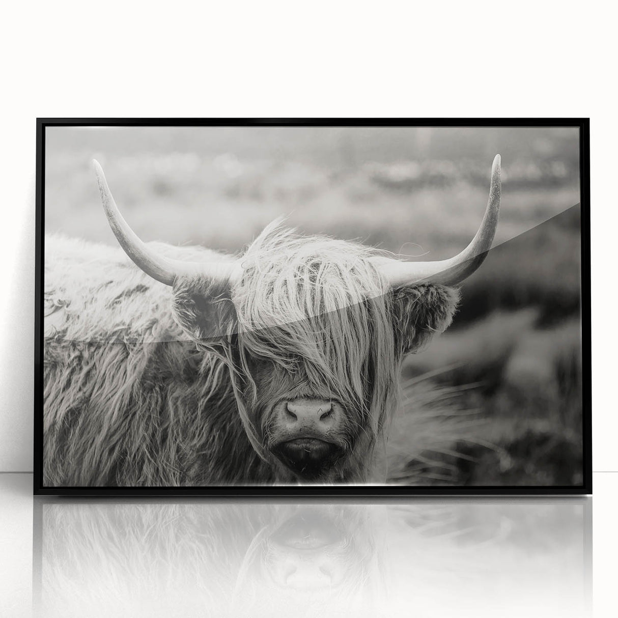 Framed wall art featuring a striking black and white cow design, showcasing intricate details against a minimalistic background, perfect for animal lovers and modern decor.