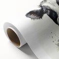 Rolled canvas artwork depicting a vibrant cow design, showcasing colorful patterns and textures, perfect for animal-themed decor or wall art collections.