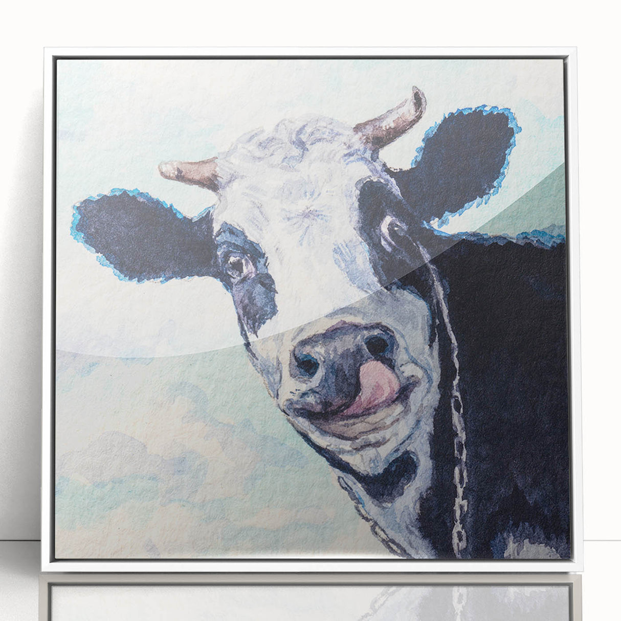 Framed wall art featuring a stylized cow design in vibrant colors, set against a white background, perfect for enhancing modern home decor and animal-themed interiors.