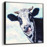 Framed canvas wall art showcasing a black and white cow design, set against a minimalist background, perfect for modern home decor. Ideal for animal lovers and rustic themes.