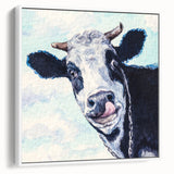 Framed canvas wall art featuring a striking cow design in soft white tones, displayed at a side view against a neutral background, perfect for modern decor.