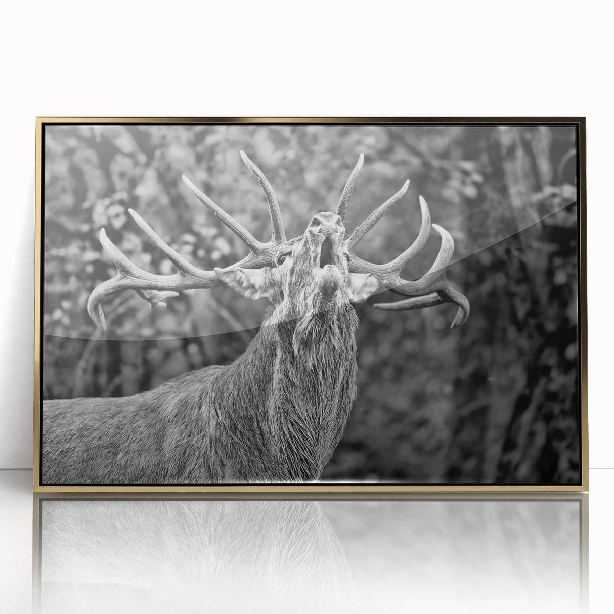 Framed wall art featuring a majestic deer design with intricate details, set in a gold-accented frame, ideal for nature-themed home decor.