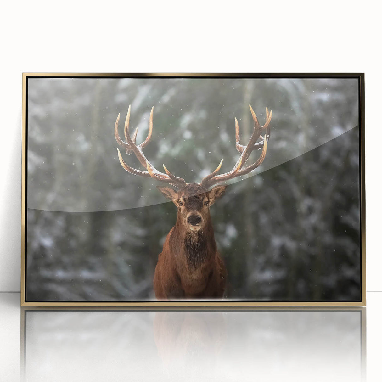 Framed wall art showcasing a majestic deer design with gold accents, set against a natural backdrop, perfect for enhancing home decor and nature-themed interiors.
