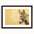 Framed wall art showcasing a whimsical donkey design in a black frame with a mat, perfect for animal-themed decor, enhancing any space with charm.