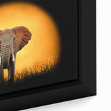 Close-up view of a framed canvas wall art featuring a vibrant elephant design in a natural setting, showcasing intricate details and bold colors, perfect for wildlife enthusiasts.
