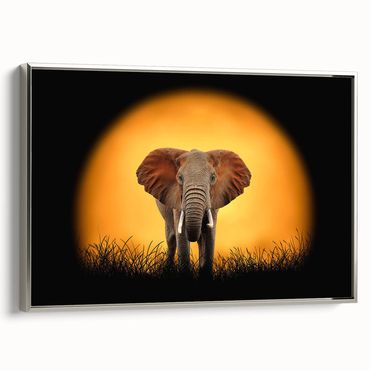 Framed canvas wall art depicting a majestic elephant in a silver-toned design. The artwork captures the essence of wildlife, showcasing intricate details and textures that enhance any decor. Ideal for nature enthusiasts and animal lovers, this piece adds a touch of elegance to home or office spaces.