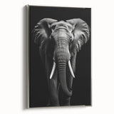 Framed wall art featuring a majestic side view of an elephant, elegantly displayed with a silver frame, perfect for nature lovers and safari-themed decor.