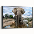 Framed wall art depicting a side view of an elephant design in vibrant colors, set against a black background, ideal for animal lovers and home decor enthusiasts.