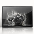 Framed wall art featuring a striking black front view of an elephant design, showcasing intricate details and vibrant colors, perfect for wildlife enthusiasts.